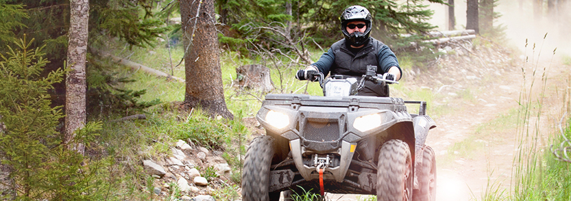 Man on ATV wearing a helmet